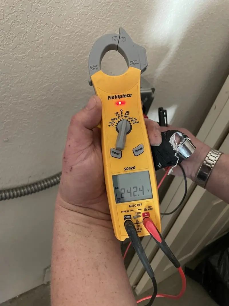 Voltage testing with clamp meter during Generator Installation in Beaumont